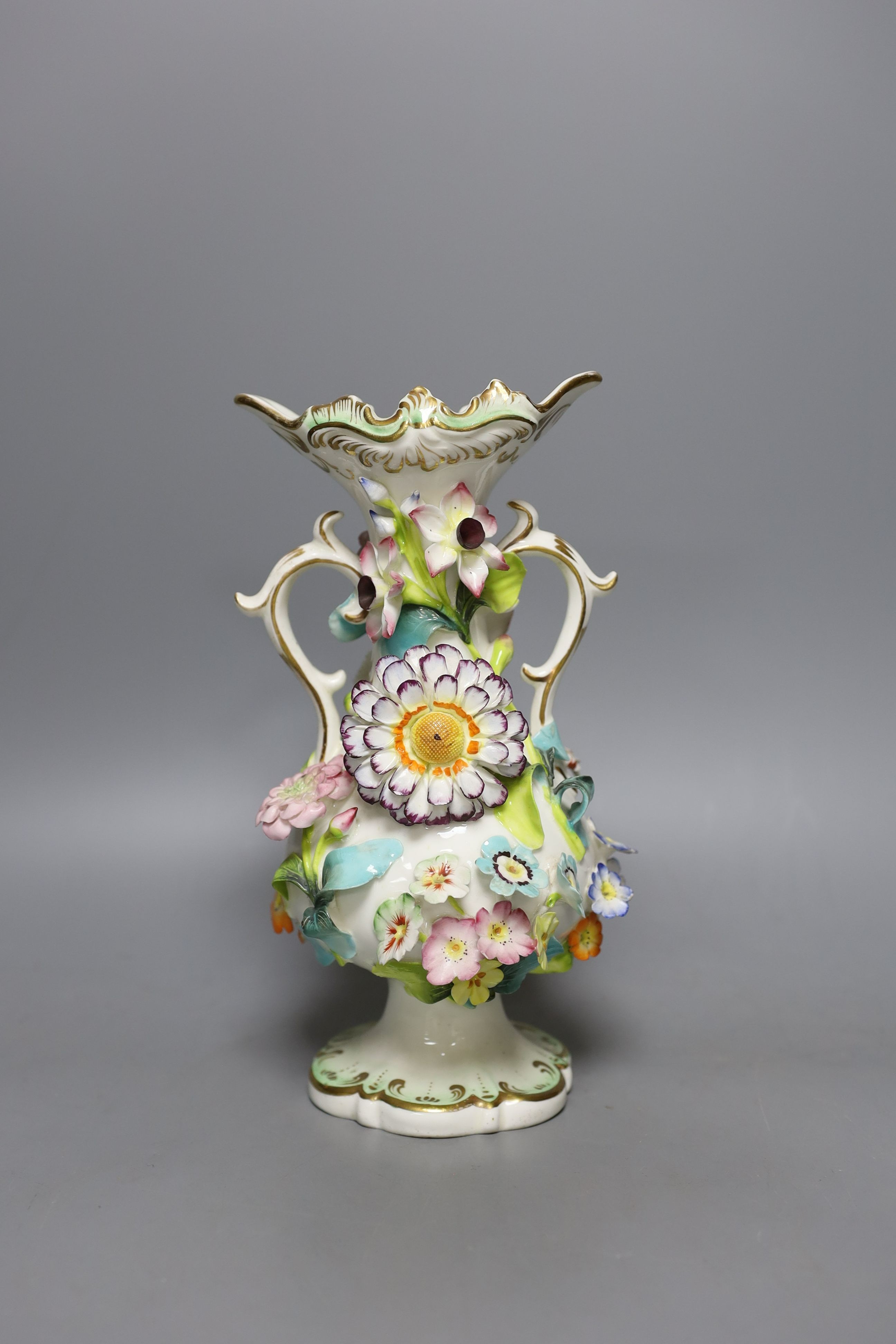 An English porcelain flower encrusted vase in Rockingham style c.1830 - 23cm high